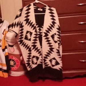 Fuzzy, patterned vest.